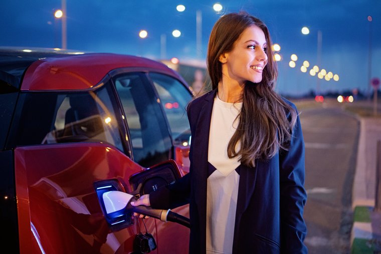 A woman charging her car