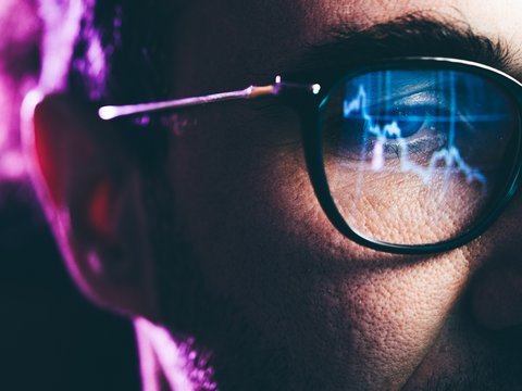 Man with glasses in digital area