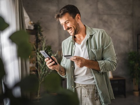 A man checks his credit card date.