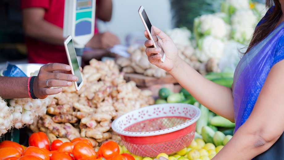 A woman pays with her smartphone