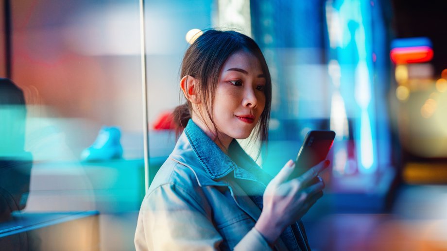 A woman uses her smartphone