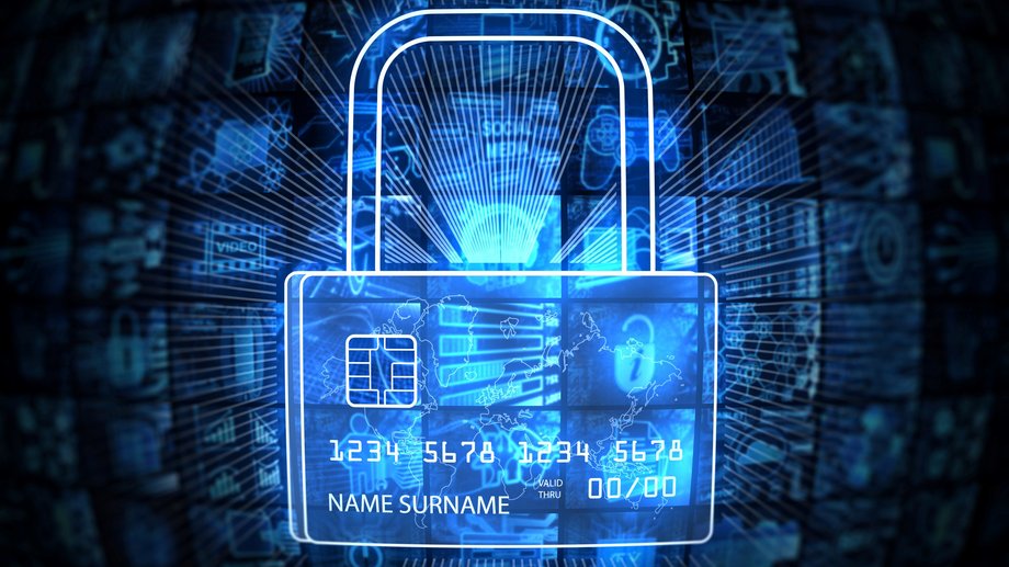 A digital lock overlays a credit card, surrounded by blue light effects.