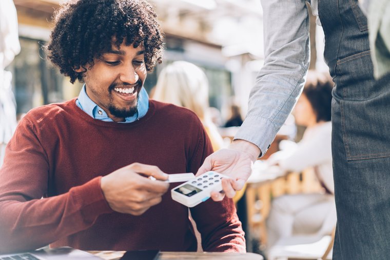 A business man pays mobile
