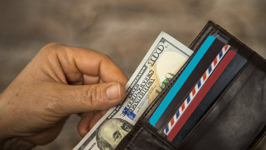 A wallet with a hundred-dollar bill