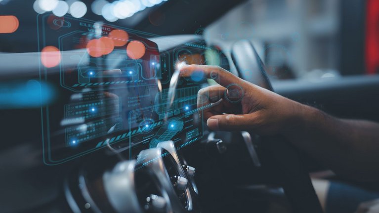 Person in a vehicle touching a digital dashboard
