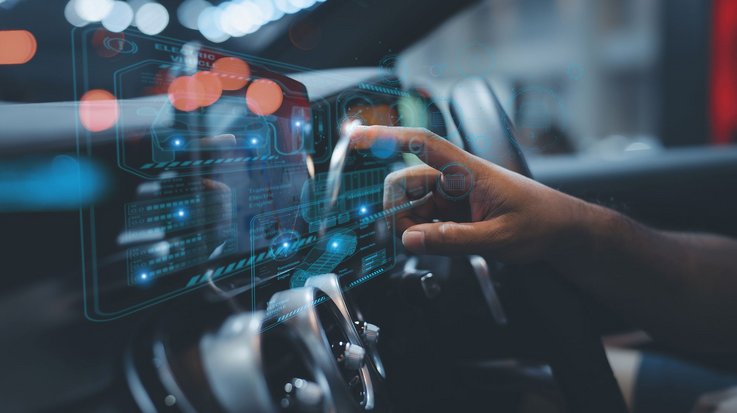 Person in a vehicle touching a digital dashboard