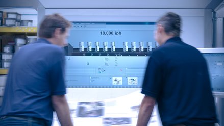 Two persons standing in front of a printwork