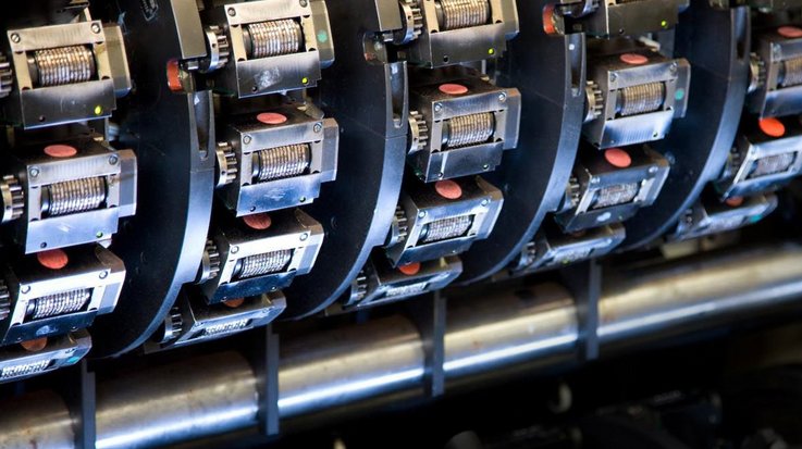 View of the printing rollers of a machine for producing banknotes