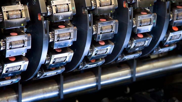 View of the printing rollers of a machine for producing banknotes