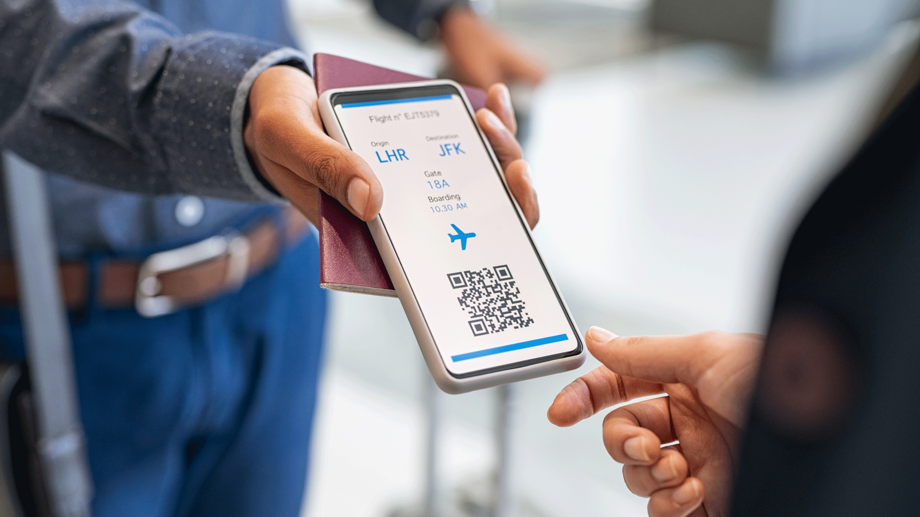 A man shows his board card on his smartphone