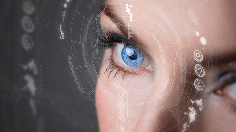 Close-up of an eye with digital structures circling in front of it